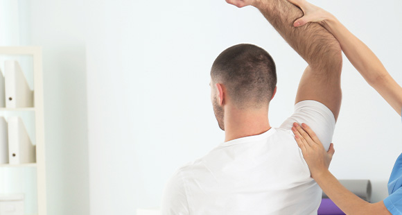 a person receiving physical therapy with an arm stretch technique in a therapeutic setting focused on recovery and rehabilitation 5 key aspects of healing